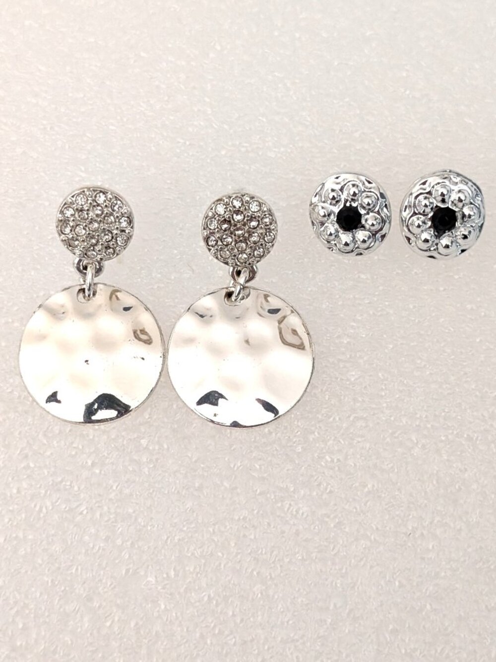 2 pairs of silver tone earrings